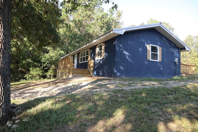 view of home's exterior with a lawn