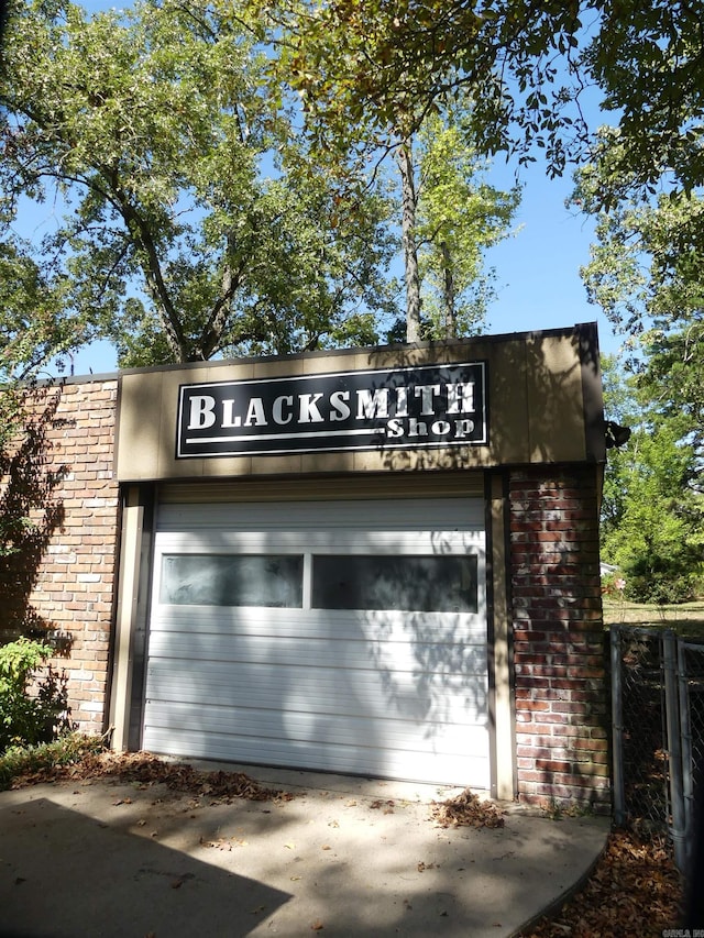 community / neighborhood sign with a garage