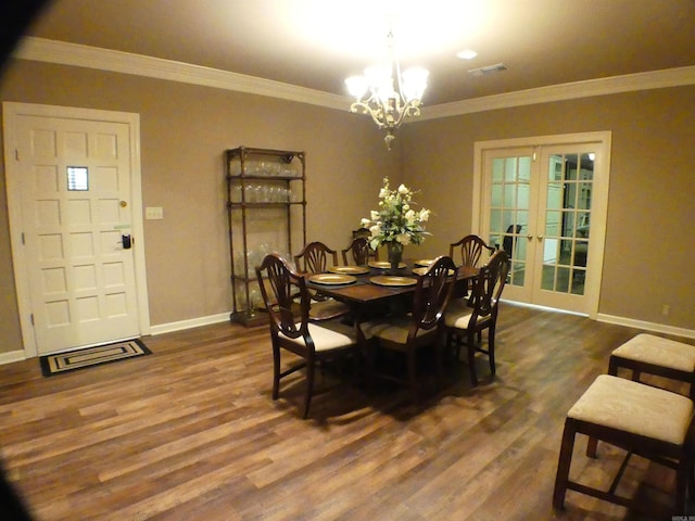 dining room featuring french doors, crown molding, and dark hardwood / wood-style flooring