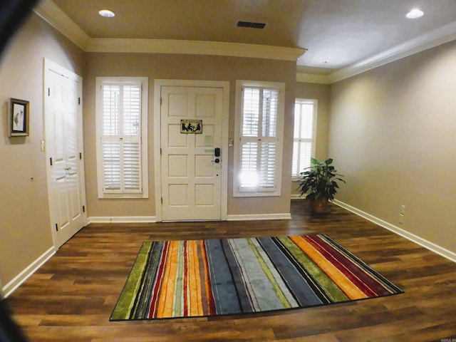 entryway with ornamental molding, dark hardwood / wood-style flooring, and a wealth of natural light