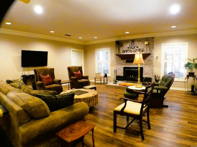 living room featuring a fireplace, hardwood / wood-style floors, and plenty of natural light