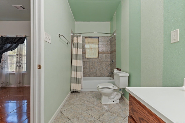 full bathroom featuring vanity, tile patterned floors, toilet, and shower / tub combo with curtain