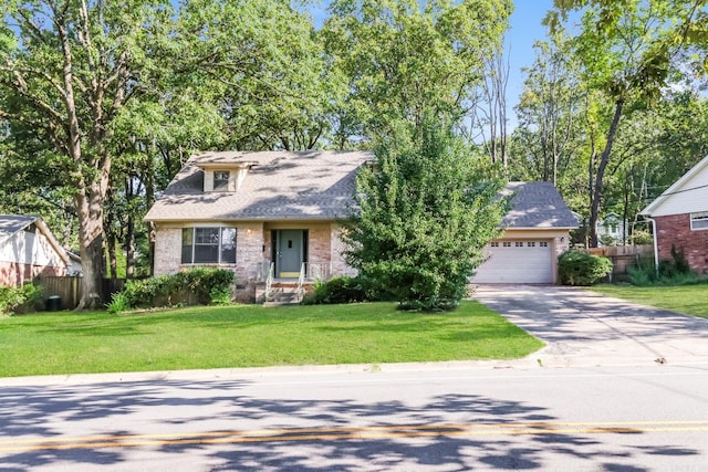 view of front of home featuring a garage and a front lawn