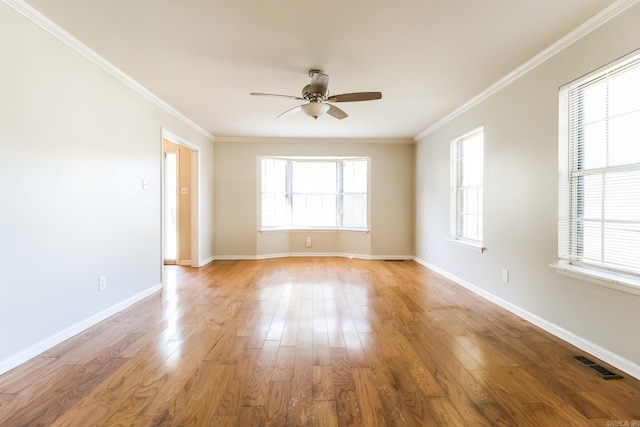 unfurnished room featuring light wood-type flooring, crown molding, and ceiling fan