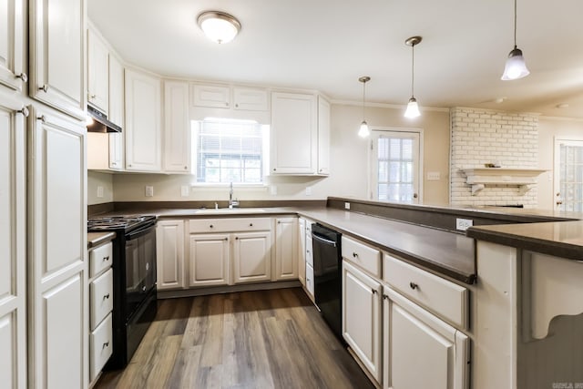 kitchen with white cabinets, pendant lighting, sink, black appliances, and dark hardwood / wood-style flooring