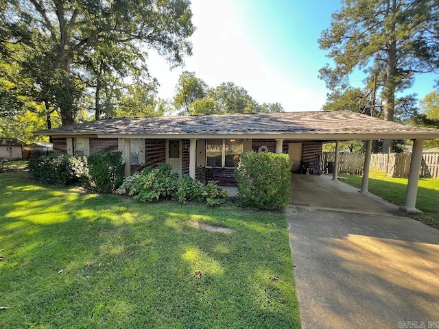 single story home featuring a front lawn, covered porch, and a carport