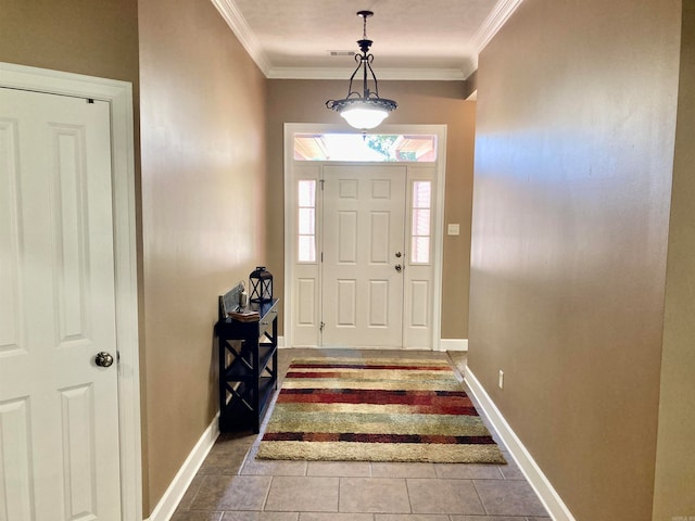 entryway with tile patterned floors and crown molding