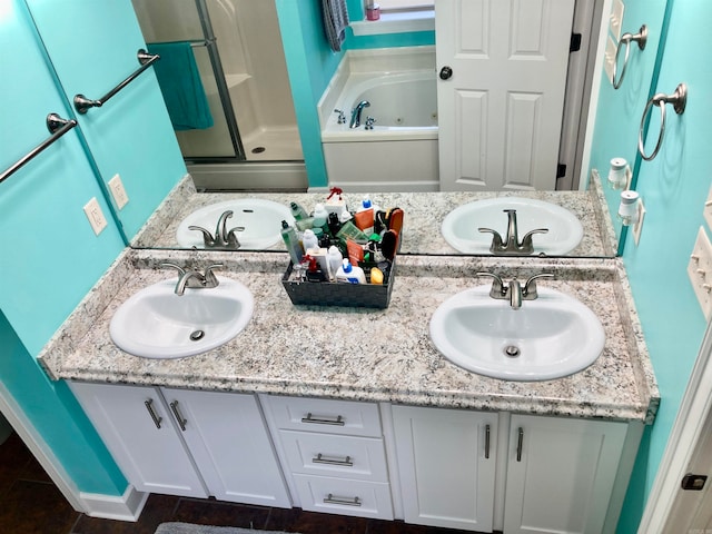 bathroom with tile patterned flooring, vanity, and separate shower and tub