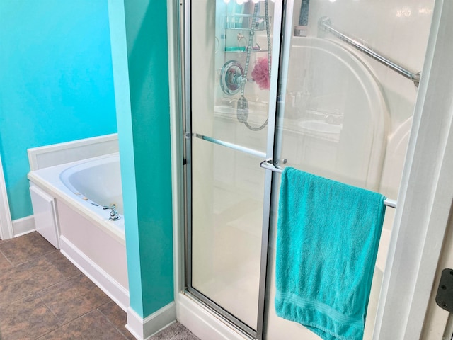 bathroom with separate shower and tub and tile patterned floors