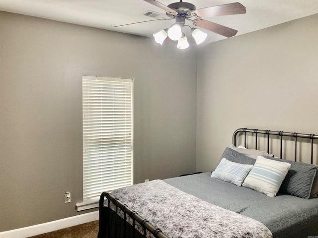 bedroom with ceiling fan and carpet flooring