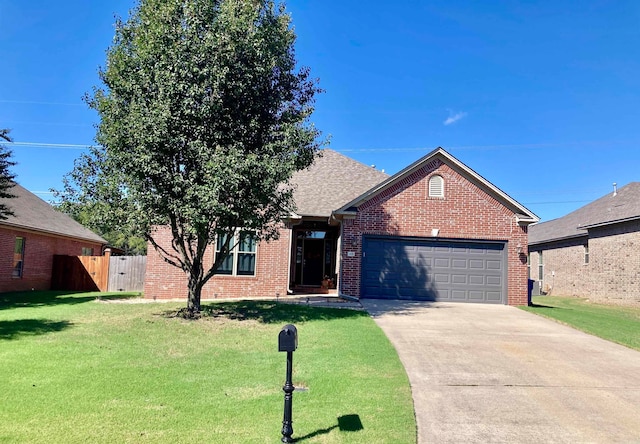 view of front facade with a garage and a front lawn