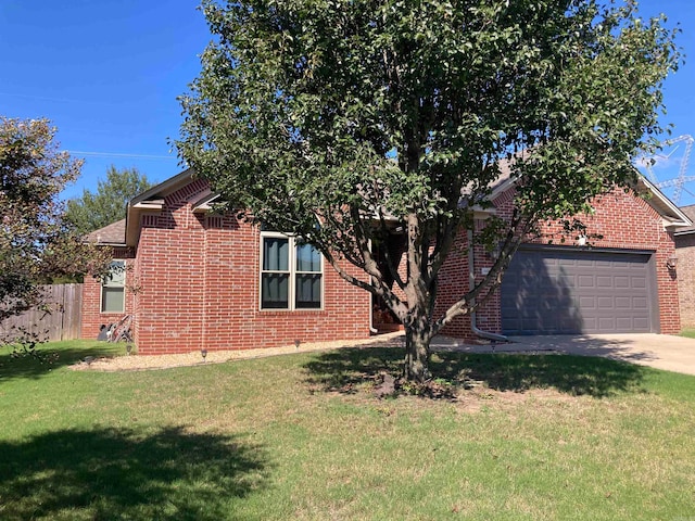 view of front of property featuring a garage and a front lawn