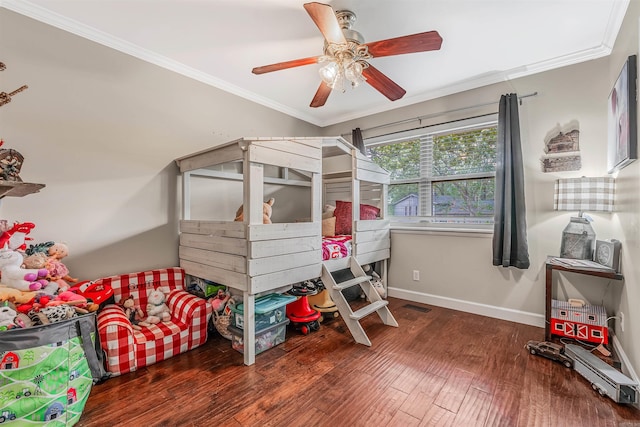 bedroom featuring ceiling fan, dark hardwood / wood-style floors, and ornamental molding