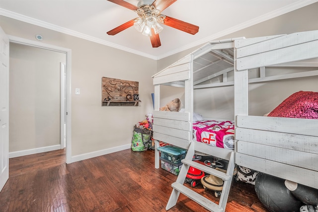 bedroom with ceiling fan, ornamental molding, and dark hardwood / wood-style flooring