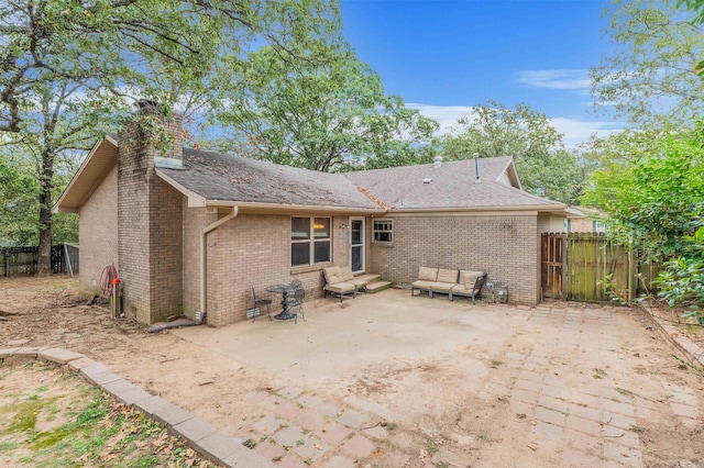 back of house featuring a patio area