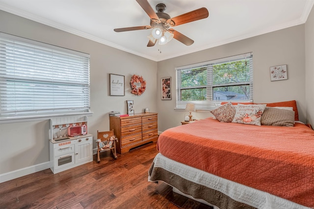 bedroom with ceiling fan, dark hardwood / wood-style floors, and ornamental molding