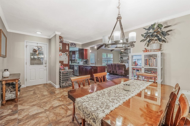 tiled dining area featuring an inviting chandelier and crown molding