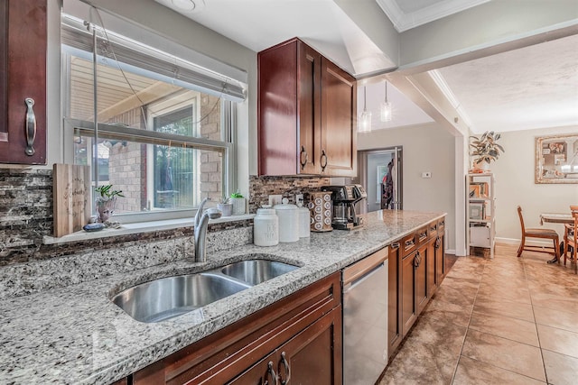 kitchen featuring backsplash, stainless steel dishwasher, sink, and light stone counters