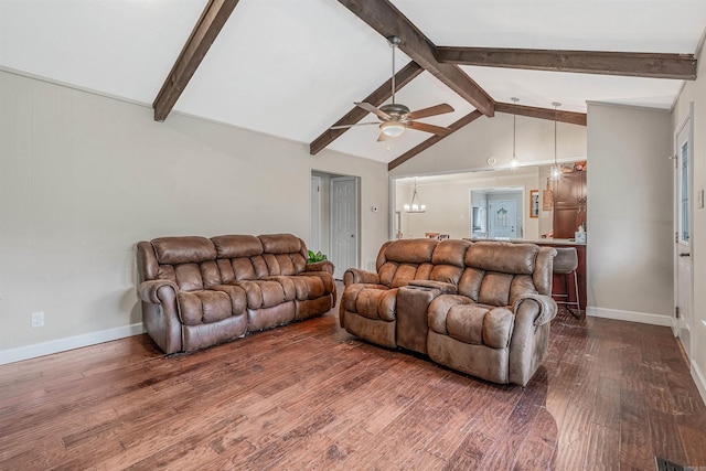 living room featuring vaulted ceiling with beams, ceiling fan with notable chandelier, and hardwood / wood-style floors