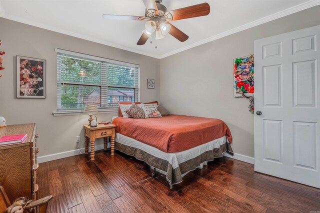 bedroom with ornamental molding, ceiling fan, and dark hardwood / wood-style floors