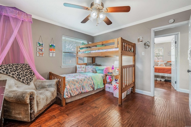 bedroom with ceiling fan, dark hardwood / wood-style floors, and crown molding