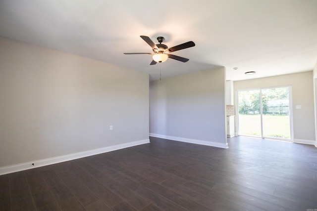 empty room with ceiling fan and dark hardwood / wood-style floors