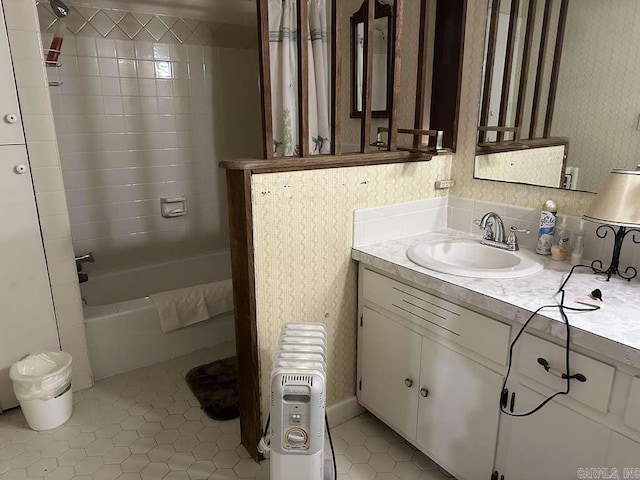 bathroom featuring shower / bath combo with shower curtain, vanity, radiator, and tile patterned flooring