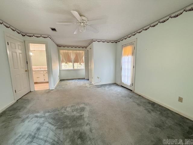 unfurnished room featuring light colored carpet and ceiling fan