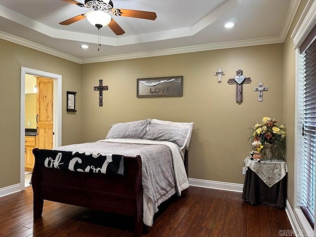 bedroom with crown molding, ceiling fan, ensuite bathroom, and dark hardwood / wood-style flooring