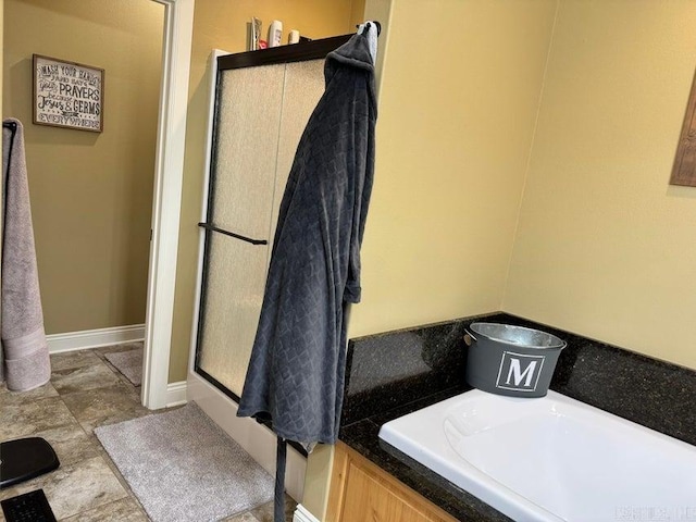 bathroom with a shower with door