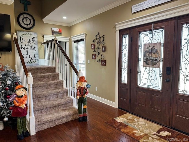 entryway featuring crown molding, plenty of natural light, and dark hardwood / wood-style flooring