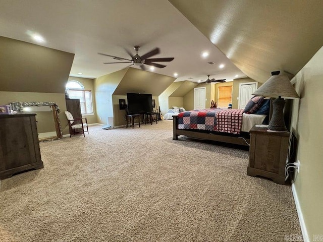 carpeted bedroom featuring lofted ceiling and ceiling fan