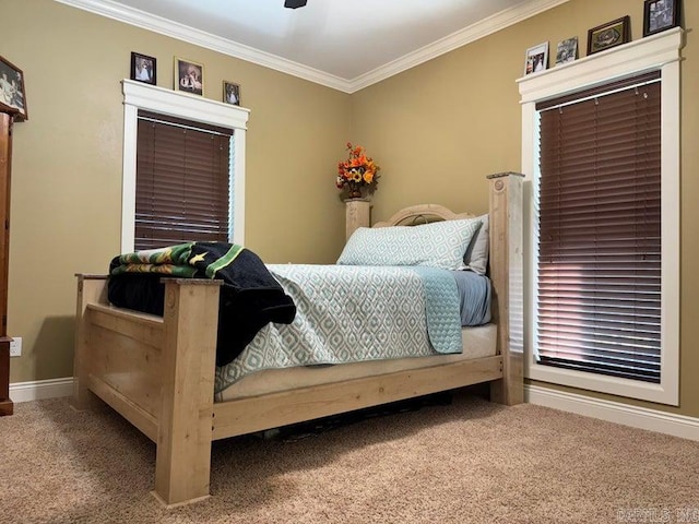 bedroom with ceiling fan, ornamental molding, and carpet