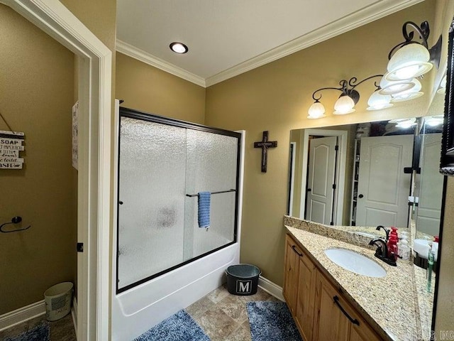 bathroom with ornamental molding, vanity, and combined bath / shower with glass door