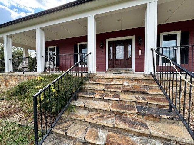 property entrance with covered porch