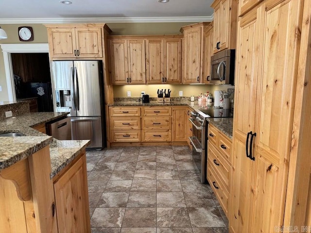 kitchen with ornamental molding, stainless steel appliances, dark stone countertops, and light brown cabinetry