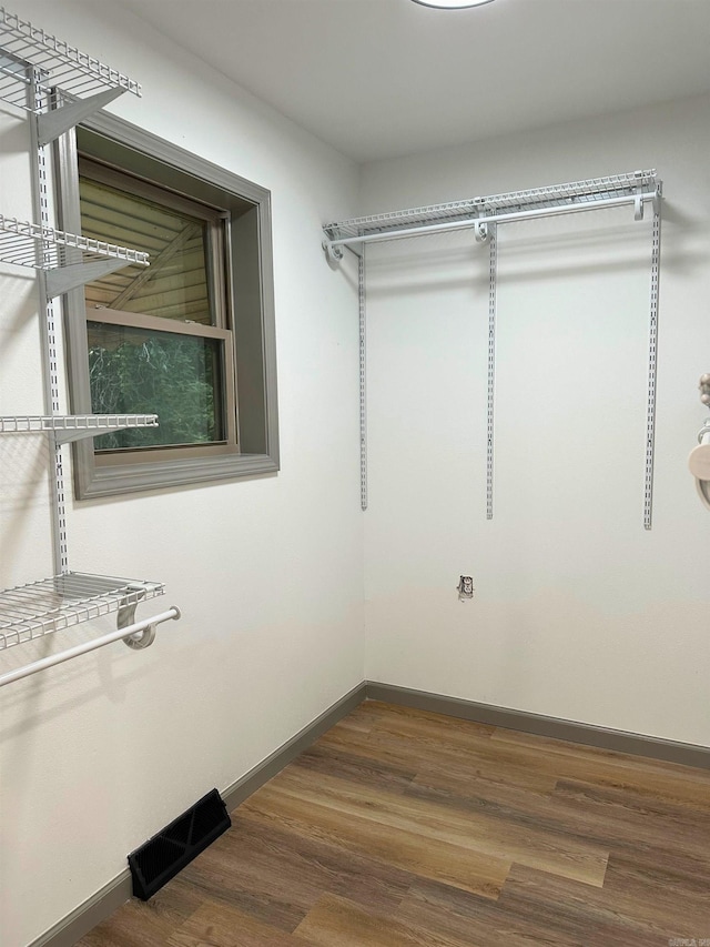 spacious closet featuring hardwood / wood-style floors