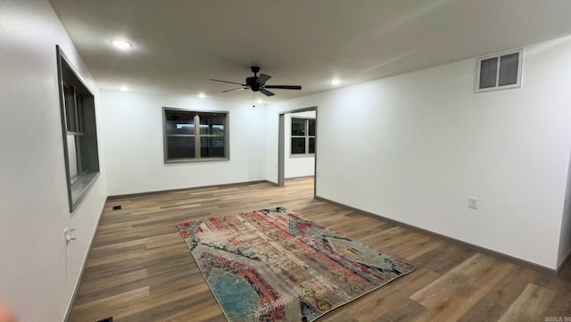 spare room featuring ceiling fan and hardwood / wood-style flooring