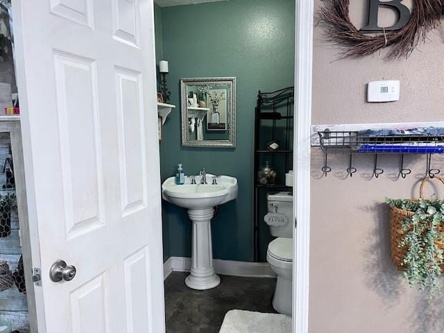 bathroom featuring toilet