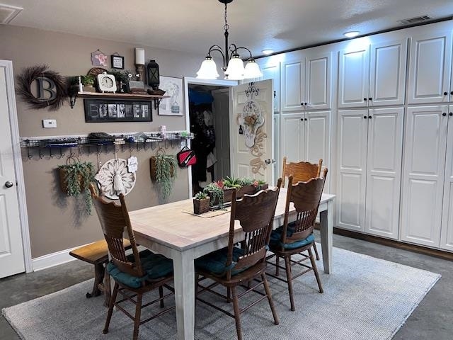 dining room featuring a notable chandelier