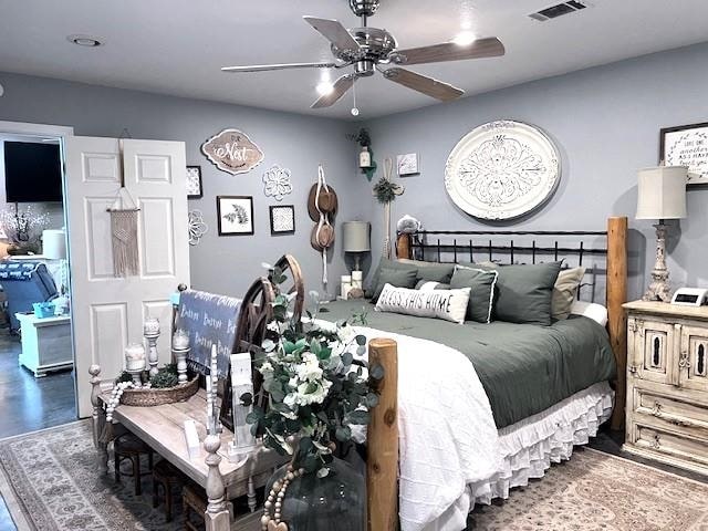 bedroom with dark wood-type flooring and ceiling fan