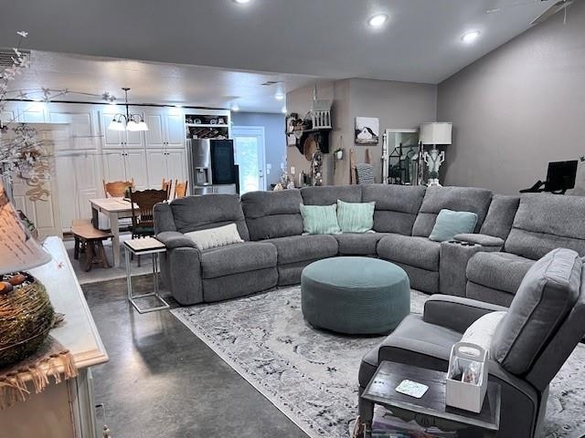 living room featuring a chandelier