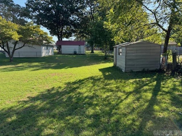 1912 Old County Rd, Pocahontas, AR 72455 - view of yard featuring an outdoor structure, a storage unit, and fence