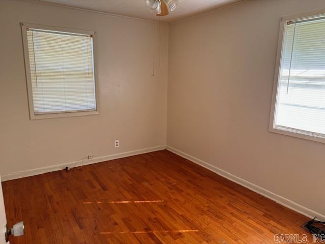 1912 Old County Rd, Pocahontas, AR 72455 - spare room featuring baseboards, ceiling fan, and wood finished floors