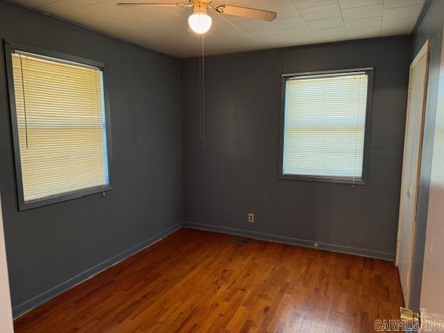 1912 Old County Rd, Pocahontas, AR 72455 - empty room featuring wood finished floors, baseboards, and ceiling fan
