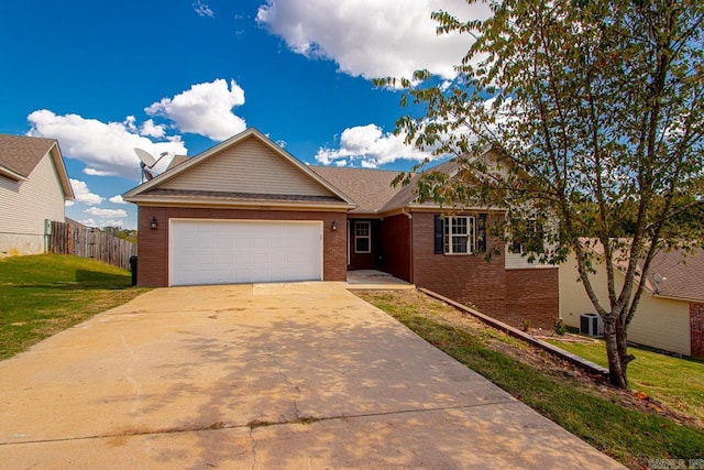 view of front of property with cooling unit, a front lawn, and a garage