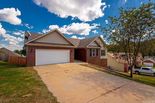 view of front of home featuring a garage and a front lawn