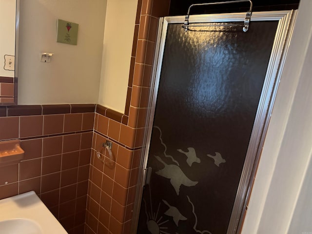 bathroom featuring walk in shower and tile walls