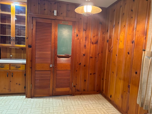 interior space featuring wood walls