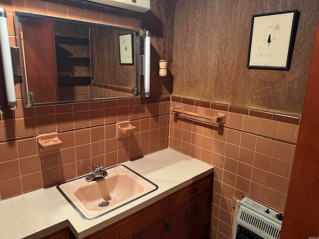 bathroom featuring vanity, tile walls, and heating unit